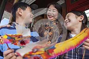 Asian family in front of store