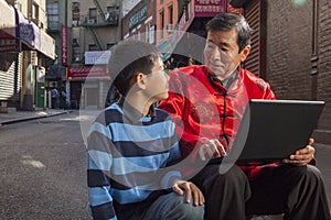 Asian family in front of store