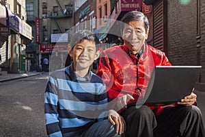 Asian family in front of store