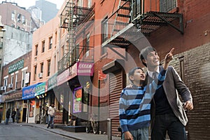 Asian family in front of store