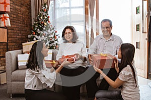 Asian family gift exchange tradition on christmas