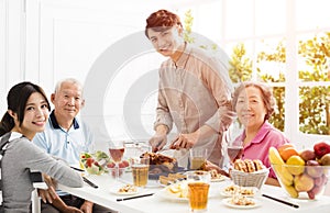 Asian family having dinner together