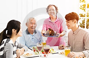 Asian family having dinner together