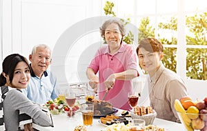 Asian family having dinner together