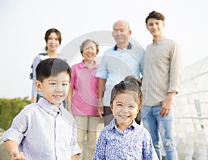 Asian family having fun together outdoors