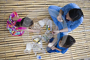 Asian  family having picnic outdoors