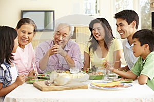 Asian family sharing meal at home