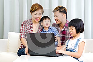 Asian family using laptop