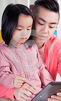 Asian family using tablet