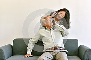 Asian family visiting and relationship, Daughter and father hugging with gentleness.