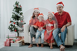 Asian family wearing red during christmas celebration