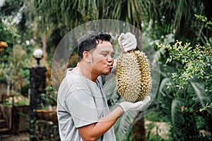 Asian farmer holding Durian is a king of fruit