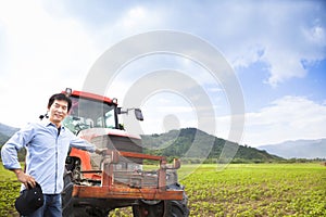 Asian farmer with Old tractor