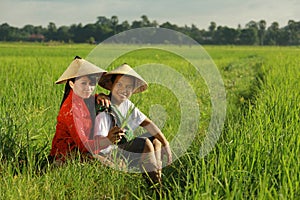 Asian farmer at rice field