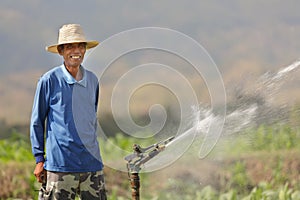 Asian farmer watering