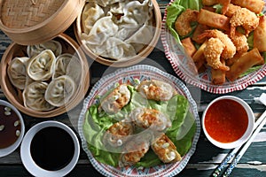 Asian fast food background spring rolls and dumpling