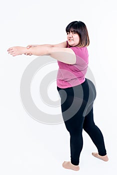 Asian fat woman Stretching arms to relax muscles after exercise To lose weight