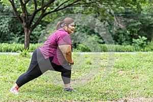 Asian fat woman workout outdoors exercising in park,