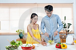 Asian father mother pregnant baby, are spending free time together on father\'s holiday, cook with mom in spare