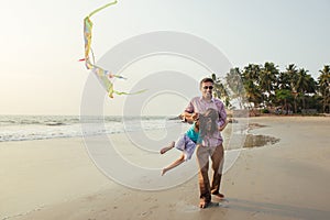 Asian father playing with his daughter