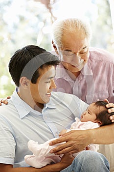 Asian father,son and granddaughter photo