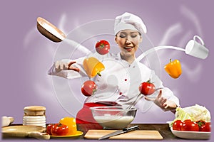 Asian female chef in the kitchen conjures