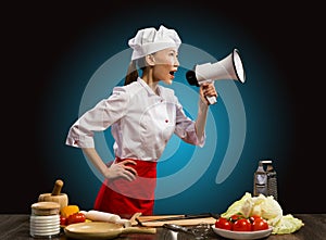Asian female chef shouting into a megaphone