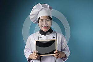 Asian Female Chef Shows Empty Blackboard, Presenting BLank Writing Template, Copy Space