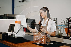 Asian female coffee shop owner in a coffee shop