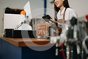 Asian female coffee shop owner in a coffee shop