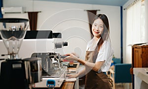 Asian female coffee shop owner in a coffee shop