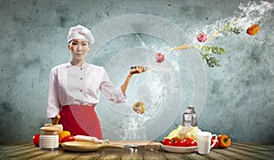 Asian female cook with knife