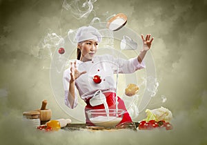 Asian female cooking with magic