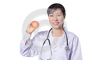 Asian female doctor holding apple with stethoscope