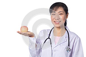 Asian female doctor holding apple with stethoscope