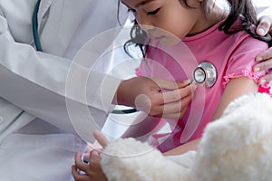 Asian female doctor is using a stethoscope Listen to heart rate Of a  year old patient