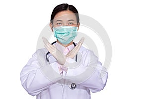 Asian female doctors wear medical masks, raise hands cross each other as a sign prohibiting or stopping to resist or prevent photo