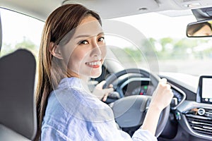 Asian female driver smile