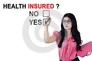 Female entrepreneur approving of health insured photo