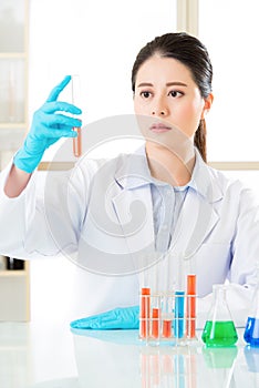 Asian female forensic scientist doing research and development