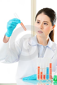 Asian female forensic scientist working on chemicals