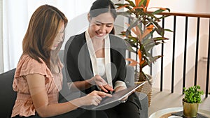 A female banker is advising a customer on a financial investment package photo