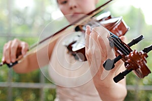 Asian female musicians playing the violin