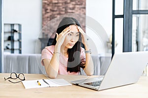 Asian female office worker staring at the screen