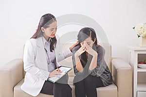 Asian female patient crying while consulting her health problem