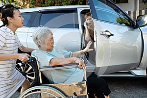 Asian female people enjoy talking on the phone,opening the door car slamming the leg of elderly feel pain,.inattentive girl photo
