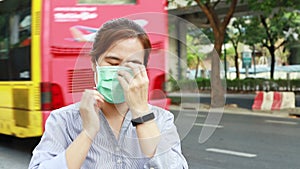 Asian female people showing how to use hygienic mask, step by step instruction, woman wearing medical face mask on street in city,