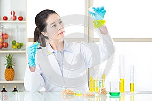 Asian female scientist looking soya for genetic modification res