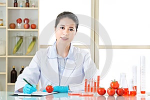 Asian female scientist recording research data for genetic modification research