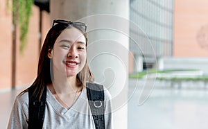 Asian female student, attractive and young smiling happy